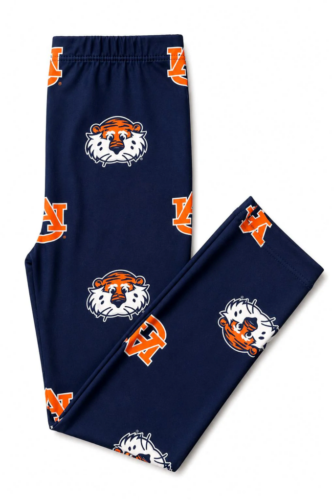 Navy blue pants with orange and white logos on a white background
